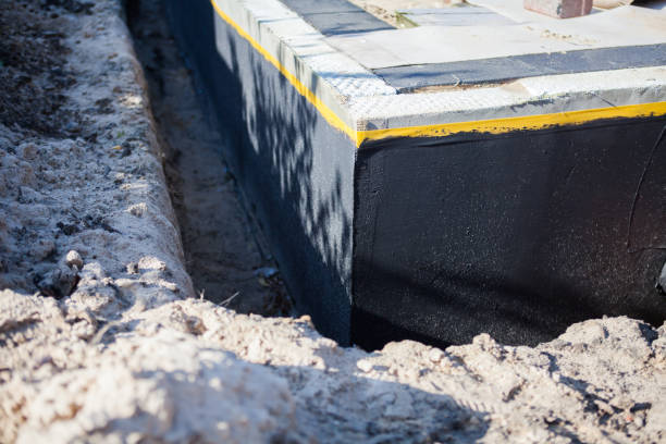 Professional Waterproofing technician working in Ray, MI